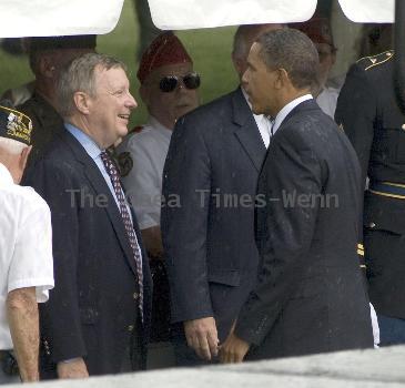 Torrential rain, lightning, thunder and strong winds forced President Barack Obama to cancel a Memorial Day speech he'd scheduled at the Abraham Lincoln National Cemetery.  Obama had mounted the podium to give the address when rain, thunder, lightning and high winds  began. Under the cover of a large umbrella, he told thousands gathered before him that