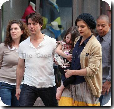 Tom Cruise, Katie Holmes
with their daughter Suri leaving the Nike store.