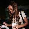 Alesha Dixon arriving at BBC Radio One studios with a coffee.