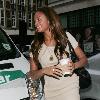 Alesha Dixon arriving at BBC Radio One studios with a coffee.