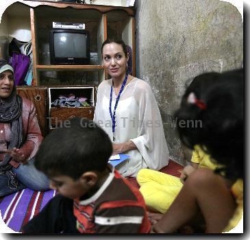 UNHCR's Goodwill Ambassador Angelina Jolie 
visits Syria to meet with Iraqi refugees in the suburb of Jaramana. She is pictured meeting Ibtissam and her family..