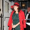 Anna Friel outside the Theatre Royal Haymarket, where she stars in 'Breakfast At Tiffany's wearing a red hat and matching red coat with a green sequined dressLondon. England Anna Friel outside the Theatre Royal Haymarket, where she stars in 'Breakfast At Tiffany's wearing a red hat and matching red coat with a green sequined dressLondon. England