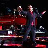 Elton John
performing live at the Olimpiyskiy Arena on the first night of his Red Piano tour.