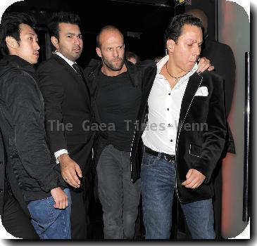 A rather worse for wear looking Jason Statham is helped out of Jalouse nightclub at 3.30am by two doormen.