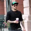 Joel Madden carrying a coffee while out and about in Beverly Hills Los Angeles.