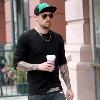 Joel Madden carrying a coffee while out and about in Beverly Hills Los Angeles.