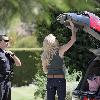 LeAnn Rimes Santa Monica police officers help LeAnn Rimes unload luggage and golf clubs from her SUV outside her home Los Angeles.