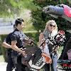 LeAnn Rimes Santa Monica police officers help LeAnn Rimes unload luggage and golf clubs from her SUV outside her home Los Angeles.