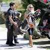 LeAnn Rimes Santa Monica police officers help LeAnn Rimes unload luggage and golf clubs from her SUV outside her home Los Angeles.