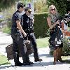 LeAnn Rimes Santa Monica police officers help LeAnn Rimes unload luggage and golf clubs from her SUV outside her home Los Angeles.