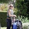 LeAnn Rimes Santa Monica police officers help LeAnn Rimes unload luggage and golf clubs from her SUV outside her home Los Angeles.