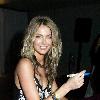 Jennifer Hawkins signs autographs during a Lovable Live Fashion Shoot at Luxe Studios Sydney.