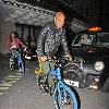 Melanie Brown and Stephen Belafonte at the May Fair Hotel pushing a blue bicycle with blue tyresLondon.