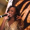 Naturi Naughton, from Fame, signs autographs and performs at the Fame music store.