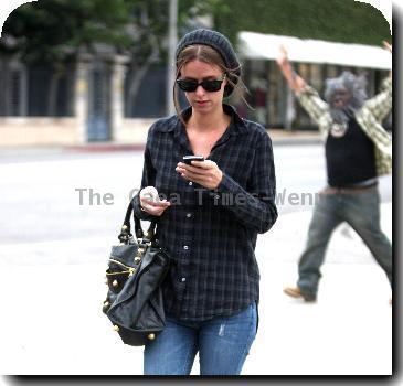 Nicky Hilton
is followed by a man in a wolf costume while out and about in West Hollywood.