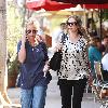 Rebecca Gayheart
wearing flip flops and a loose top out and about lunching with a friend.