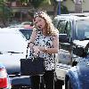 Rebecca Gayheart
wearing flip flops and a loose top out and about lunching with a friend.