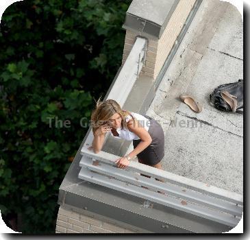 Jennifer Aniston filming a roof top scene