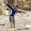 Matthew McConaughey exercises on the beach with and oarMalibu.