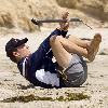 Matthew McConaughey exercises on the beach with and oarMalibu.