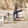 Matthew McConaughey exercises on the beach with and oarMalibu.