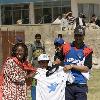 Catherine Mbengue head of UNICEF in Afghanistan and Raees Ahmadzai 'UNICEF Peace Day' celebrations at a Children's Cricket Camp hosted by the Afghan national cricket team. Kabul.