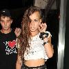 Alice Dellal 
leaves the Proud Gallery in North London.