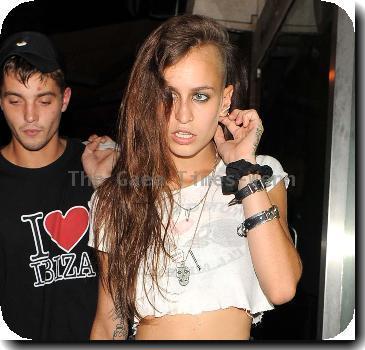 Alice Dellal 
leaves the Proud Gallery in North London.