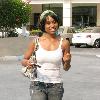 April Clark of movie 'ATL' shopping at an outdoor mall wearing a white top and headscarf.