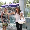 Ashley Tisdalejumps with excitement when she greets her personal trainer outside a West Hollywood gymLos Angeles.