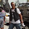 **Exclusive** Actor Brian J. White arrives at his hotel, wearing dog-tags and a waistcoat and signs autographs for waiting fans New York City.