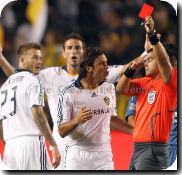 David Beckham of the Los Angeles Galaxy is sent off with a red card for a foul on Peter Vagenas of the Seattle Sounders FC at The Home Depot Center..