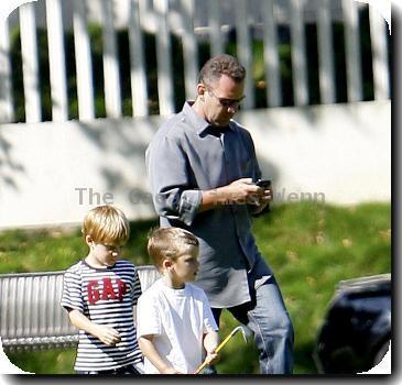 Cruz Beckham, Victoria Beckham and David Beckham's children playing golf at a park in Beverly Hills Los Angeles.