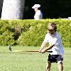 Cruz Beckham, Victoria Beckham and David Beckham's children playing golf at a park in Beverly Hills Los Angeles.