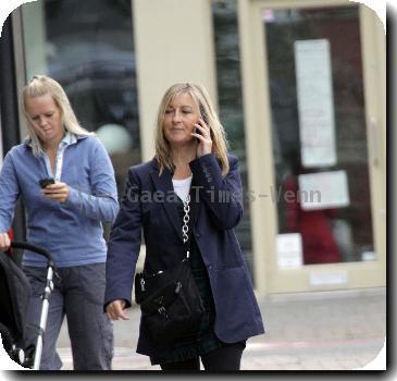 Fiona Phillips chats on her mobile phoneas she takes a stroll near her homeLondon.