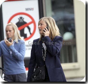 Fiona Phillips chats on her mobile phoneas she takes a stroll near her homeLondon.