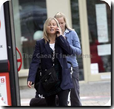 Fiona Phillips chats on her mobile phoneas she takes a stroll near her homeLondon.