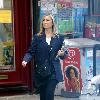 Fiona Phillips chats on her mobile phoneas she takes a stroll near her homeLondon.