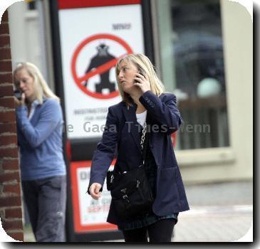 Fiona Phillips chats on her mobile phoneas she takes a stroll near her homeLondon.