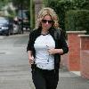 Geri Halliwell 
goes out for an early morning jog wearing a 'Team Halliwell' Tee Shirt..