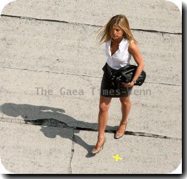 Jennifer Aniston 
filming a roof top scene where her character was to jump off the ledge for her new film 'The Bounty'.