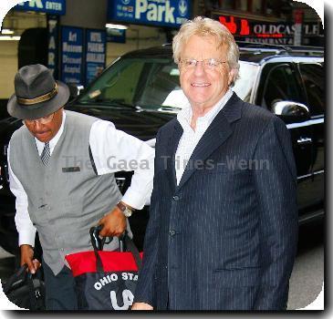 Jerry Springer poses for photographs as he arrives at his Manhattan hotelNew York City.