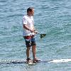 Jon Favreau spends a day paddleboarding on Malibu Beach. Los Angeles, California.