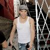 Kellan Lutz is all smiles as he leaves Bardot nightclub in Hollywood after a photoshoot for H&M clothing wearing a white vest top.Los Angeles, California.