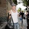 Kellan Lutz is all smiles as he leaves Bardot nightclub in Hollywood after a photoshoot for H&M clothing wearing a white vest top.Los Angeles, California.