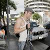 Kellan Lutz is all smiles as he leaves Bardot nightclub in Hollywood after a photoshoot for H&M clothing wearing a white vest top.Los Angeles, California.