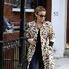 Kylie Minogue
leaves her apartment and heads to a West London office
wearing a stunning leopard print coat.