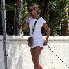 **Exclusive** Lady Victoria Hervey, wearing a little white dress, talks on her  phone as she walks her dogs in HollywoodLos Angeles.