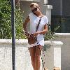 **Exclusive** Lady Victoria Hervey, wearing a little white dress, talks on her  phone as she walks her dogs in HollywoodLos Angeles.