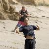 Matthew McConaughey soaks up the Southern California sun playing with his dogs and exercising along Malibu beach.